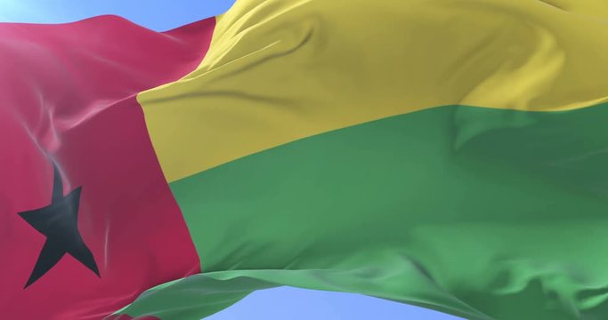 Bissau-Guinean flag waving at wind in slow in blue sky, loop