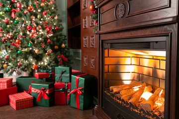 pile of Christmas gifts close-up under the Christmas tree. red and green presents
