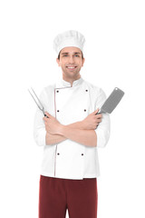 Young male chef with meat fork and knife, isolated on white