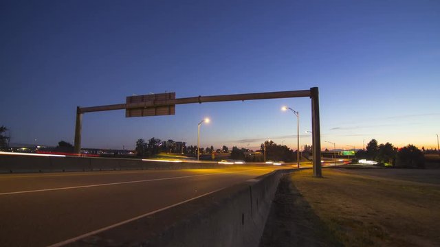 Time lapse of twilight traffic on a busy road