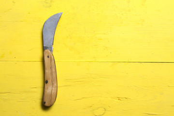 Curved pocket knife close up.