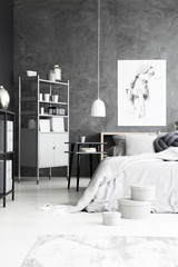 Grey bedroom with concrete wall