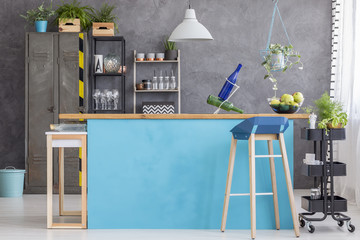 Dining room with blue kitchenette