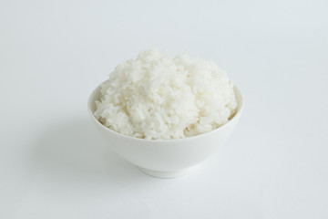 STEAMED RICE
Steamed rice in a white bowl are served on white background. 