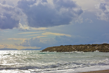Fototapeta na wymiar Stormy winter Mediterranean sea and cloudly sky
