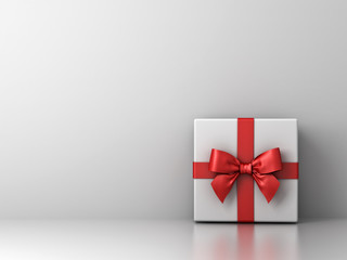 Gift box with red ribbon bow and empty white wall background abstract for decoration . 3D rendering.