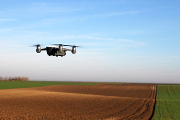 Fototapeta na wymiar The drone is flying over the field landscape