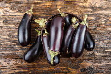harvest of eggplant on a wooden table