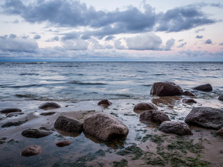 Seascape With Rocks Lying On Sea Coast In The Morning