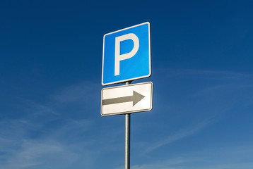 Parking sign on blue sky background