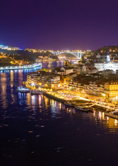 Colorful downtown river city with bridges at night background, Porto Portugal