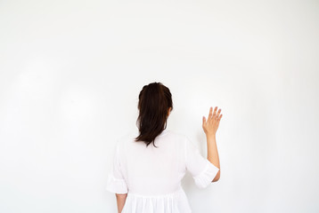 Girl making wave hand gesture on white background