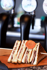 club sandwich on wood plate 