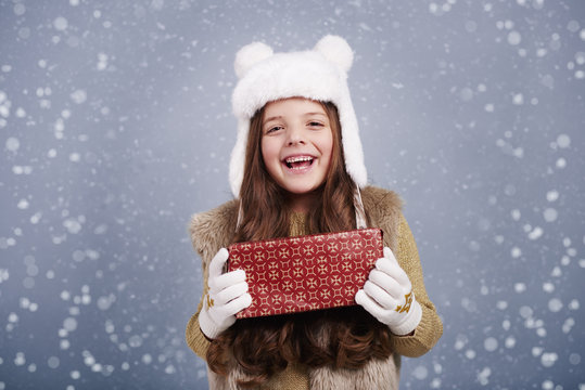 Cute girl with christmas present.