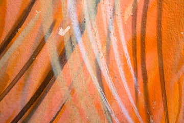 fragments of graffiti on a concrete wal