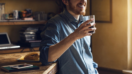 Hipster man drinking a glass of coke