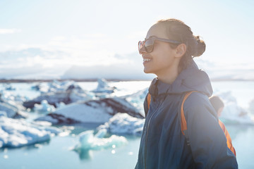 Fototapeta premium Woman with backpack in Ice Lagoon in Iceland