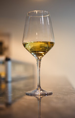 Glass of white wine on bar