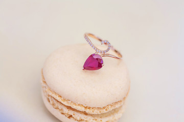 Luxury engagement ring on sweet little macaron