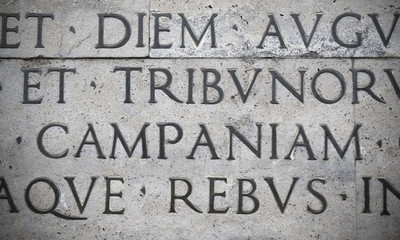 Latin inscription on the outside wall of Ara Pacis wall in Rome, Italy © BlackMac