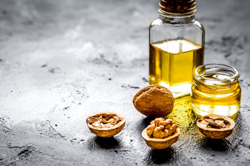 cosmetic and therapeutic walnut oil on dark background