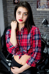 Fototapeta na wymiar sexy girl with big eyes on a background of a motorcycle