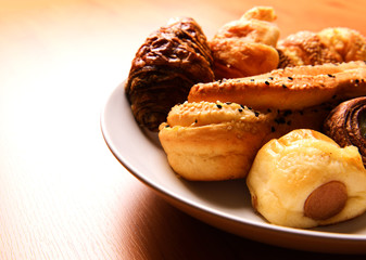 Bakery foodstuffs on wood board
