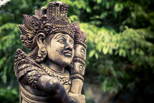 Stone carved balinese statue