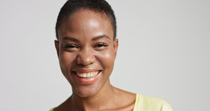 pretty mixed race woman with short hair laughing