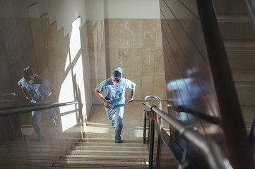 Man walking up stairs in hospital