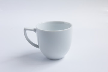 White empty ceramic coffee cup on white background