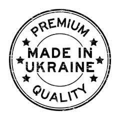 Grunge black premium quality made in Urkaine round rubber seal stamp on white background
