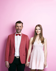 Cheerful affectionate couple holding hands