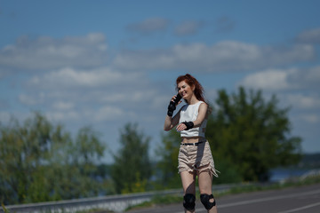 Beautiful young girl roller skating