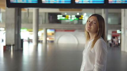 Cute blonde in empty airport