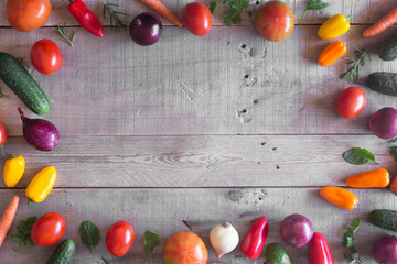 Naklejka na ściany i meble Fresh organic vegetables on a wooden background. Top view