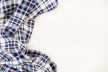 Creative minimal Christmas concept. winter vacation layout with scarf on a gray wooden shabby table space in middle. Flat lay. Top view. New Year holiday background.