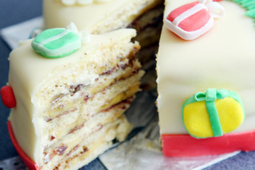 slice, portion of handmade decorated with sugar paste, fondant christmas cake: cut of banana and...