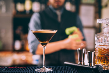 Martini based whiskey cocktail mixed with beer at bar