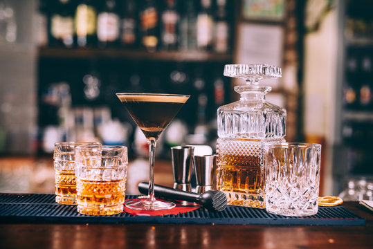 delicious whiskey based cocktails, alcoholic beverages in modern bar