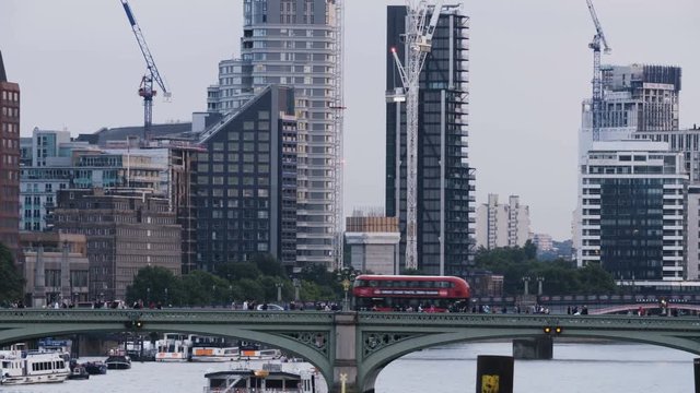 Double-Decker Bus Moving Through the Westminster Bridge