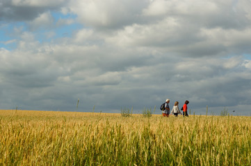 hikers in a field after the storm