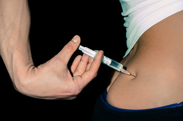Steroids, Young person inject anabolic steroids in her muscle doping in sport concept