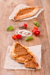 Turkish pide pizza with meat and onion.