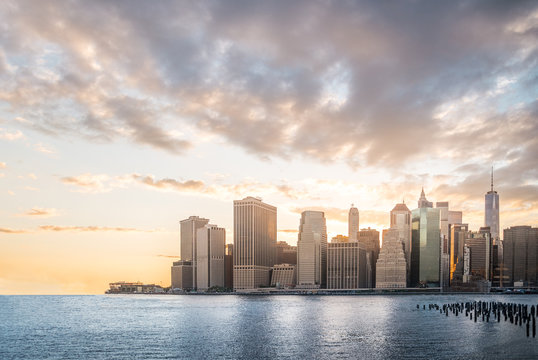 Cityscape with beautiful skyline at sunset, skyscraper in Manhattan, New York City, USA