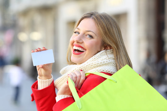 Shopper Showing Credit Card In Winter