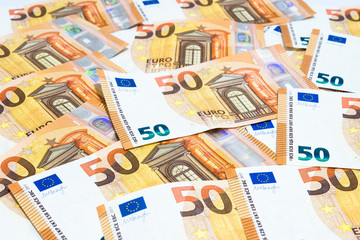 Pile of many fifty euro banknotes use for money or currency background and financial concepts.