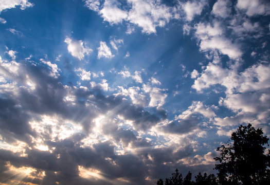 White And Grey Fluffy Clouds In The Blue Sky With Morning Light