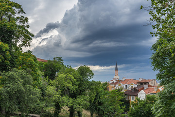 Cloudy sky over Plovdiv skyline with Dzhumaya minaret, Bulgaria
