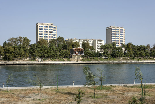 Azerbaijan, Mingachevir: Cityscape with modern apartment buildings, Kur river and cable car. 